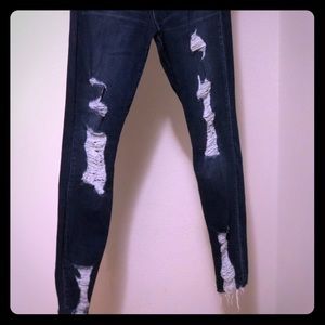 Ultra distressed dark skinny jeans